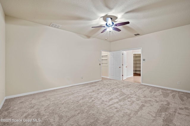 2690 Cypress Tree Trl, Saint Cloud, FL 34772 - unfurnished room with a ceiling fan, carpet flooring, and a textured ceiling