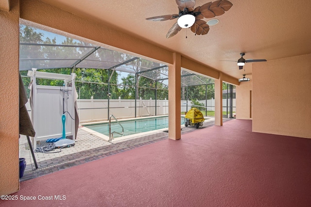 2690 Cypress Tree Trl, Saint Cloud, FL 34772 - view of swimming pool with a patio area, a ceiling fan, a fenced backyard, and glass enclosure