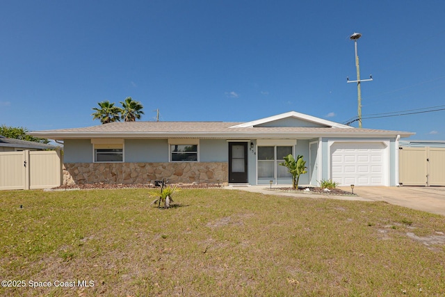 858 Bianca Dr NE, Palm Bay, FL 32905 - ranch-style house featuring stone siding, a gate, an attached garage, and concrete driveway