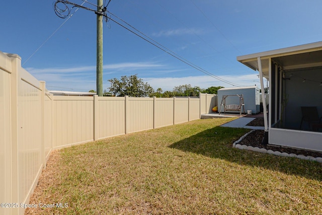 858 Bianca Dr NE, Palm Bay, FL 32905 - fenced backyard with a sunroom