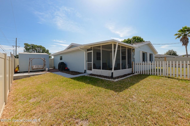 858 Bianca Dr NE, Palm Bay, FL 32905 - rear view of property featuring a sunroom