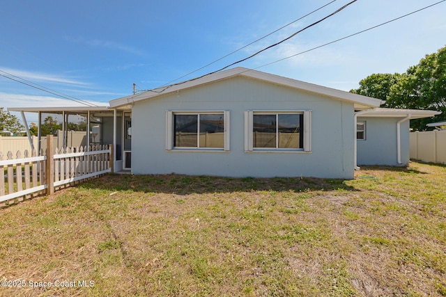 858 Bianca Dr NE, Palm Bay, FL 32905 - view of side of home featuring a sunroom and stucco siding