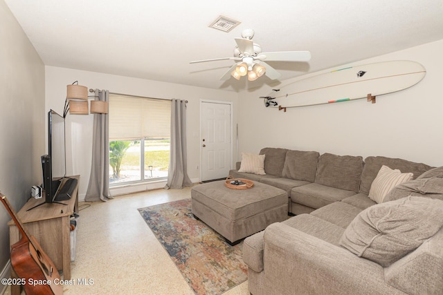 858 Bianca Dr NE, Palm Bay, FL 32905 - living room featuring speckled floor and ceiling fan