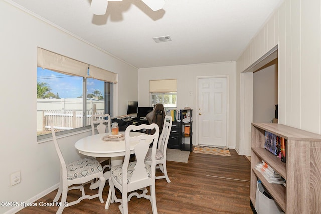858 Bianca Dr NE, Palm Bay, FL 32905 - dining area with dark wood finished floors, a ceiling fan, and crown molding