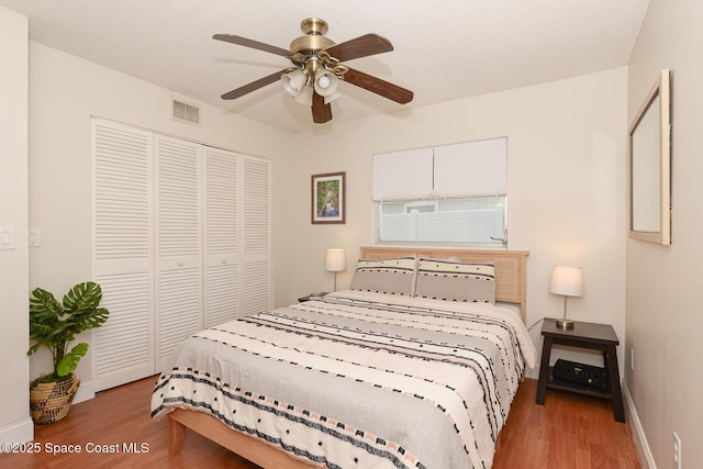 858 Bianca Dr NE, Palm Bay, FL 32905 - bedroom featuring wood finished floors, a closet, and a ceiling fan