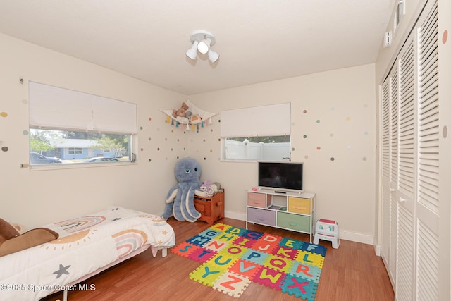 858 Bianca Dr NE, Palm Bay, FL 32905 - bedroom featuring a closet and wood finished floors
