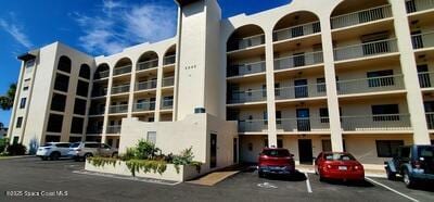 5805 N Banana River Blvd Unit 1117, Cape Canaveral, FL 32920 - view of apartment building / complex featuring uncovered parking
