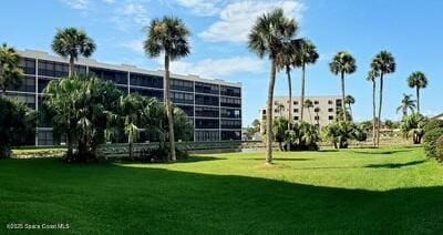 5805 N Banana River Blvd Unit 1117, Cape Canaveral, FL 32920 - surrounding community featuring a yard