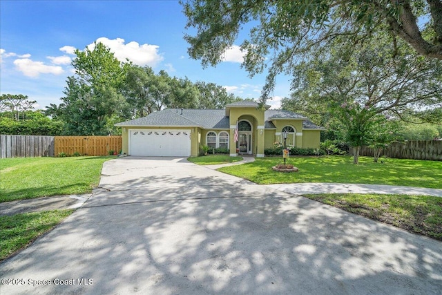 3635 Manassas Ave, Melbourne, FL 32934 - mediterranean / spanish home with a garage, driveway, and stucco siding