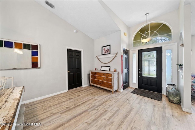3635 Manassas Ave, Melbourne, FL 32934 - foyer entrance featuring high vaulted ceiling and wood finished floors