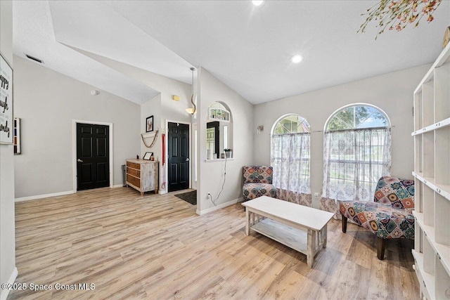 3635 Manassas Ave, Melbourne, FL 32934 - living room featuring vaulted ceiling, light wood-type flooring, and recessed lighting
