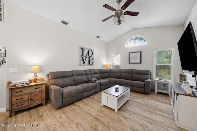 3635 Manassas Ave, Melbourne, FL 32934 - living room with a ceiling fan, vaulted ceiling, and light wood-style flooring