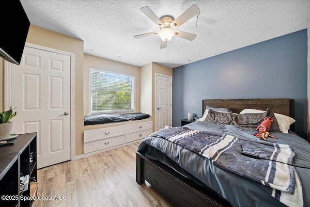 3635 Manassas Ave, Melbourne, FL 32934 - bedroom featuring light wood-style floors, a textured ceiling, and ceiling fan