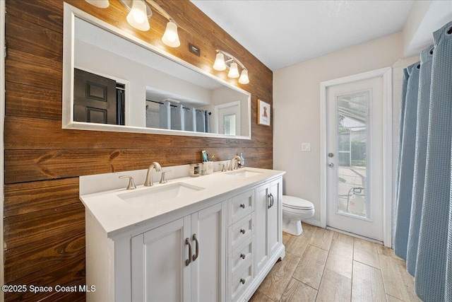 3635 Manassas Ave, Melbourne, FL 32934 - bathroom with double vanity and wood finished floors