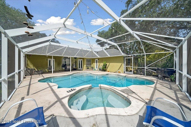 3635 Manassas Ave, Melbourne, FL 32934 - view of swimming pool with a patio area, a pool with connected hot tub, and a lanai