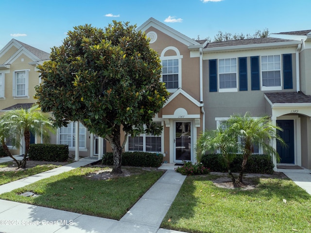 1347 Hampton Park Ln, Melbourne, FL 32940 - view of front of home featuring stucco siding and a front yard