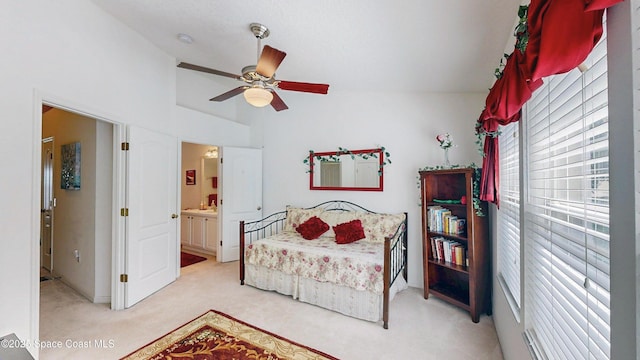 1347 Hampton Park Ln, Melbourne, FL 32940 - bedroom featuring light carpet, vaulted ceiling, ceiling fan, and ensuite bath