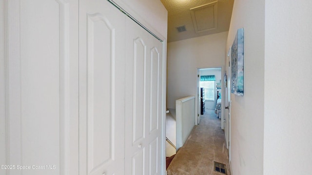 1347 Hampton Park Ln, Melbourne, FL 32940 - corridor featuring light carpet and attic access