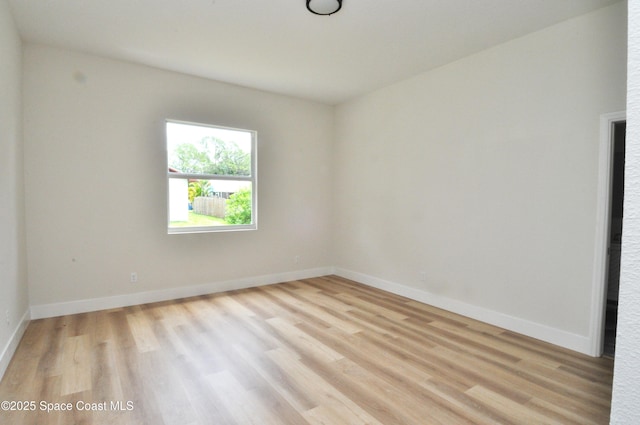 1043 Walden Blvd SE, Palm Bay, FL 32909 - unfurnished room with light wood-style floors and baseboards