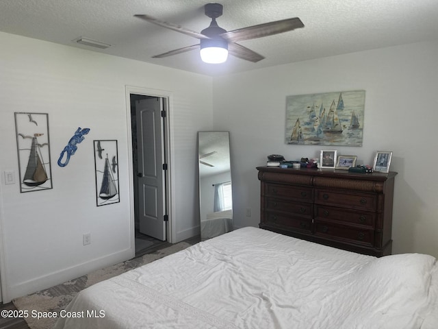 6240 Grissom Pkwy, Cocoa, FL 32927 - bedroom with a textured ceiling and a ceiling fan