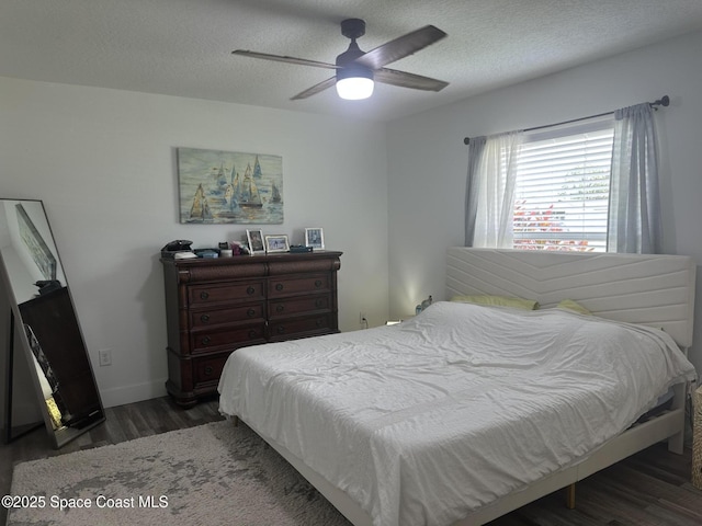 6240 Grissom Pkwy, Cocoa, FL 32927 - bedroom featuring wood finished floors, a textured ceiling, and a ceiling fan