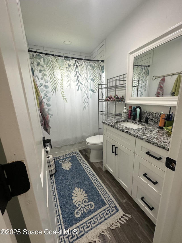 6240 Grissom Pkwy, Cocoa, FL 32927 - bathroom featuring vanity and wood finished floors