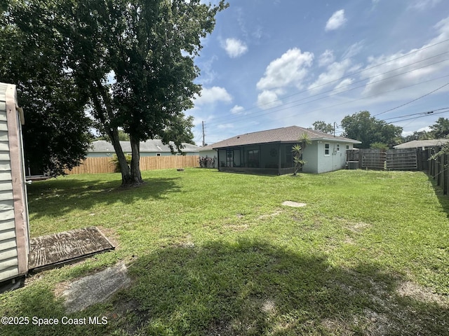 6240 Grissom Pkwy, Cocoa, FL 32927 - fenced backyard with a sunroom