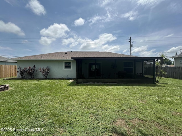 6240 Grissom Pkwy, Cocoa, FL 32927 - back of property with a sunroom, a shingled roof, and stucco siding