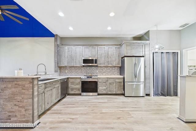 1720 Minutemen Cswy Unit 3, Cocoa Beach, FL 32931 - kitchen featuring appliances with stainless steel finishes, light wood-style flooring, backsplash, ceiling fan, and recessed lighting