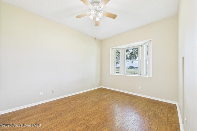 1720 Minutemen Cswy Unit 3, Cocoa Beach, FL 32931 - unfurnished room with wood finished floors and ceiling fan