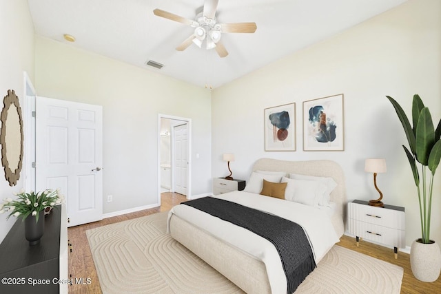 1720 Minutemen Cswy Unit 3, Cocoa Beach, FL 32931 - bedroom featuring wood finished floors, ensuite bath, and ceiling fan