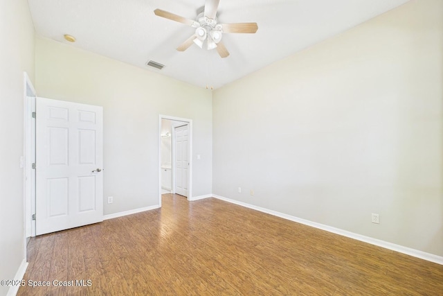 1720 Minutemen Cswy Unit 3, Cocoa Beach, FL 32931 - unfurnished bedroom featuring wood finished floors, ensuite bath, and ceiling fan