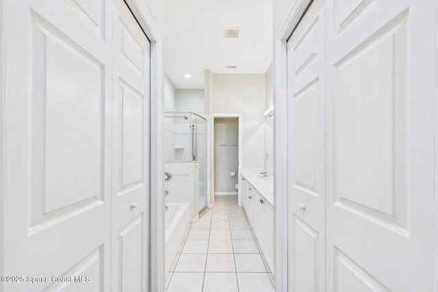 1720 Minutemen Cswy Unit 3, Cocoa Beach, FL 32931 - bathroom featuring a closet, tile patterned flooring, and washtub / shower combination