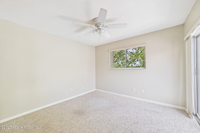 1720 Minutemen Cswy Unit 3, Cocoa Beach, FL 32931 - unfurnished bedroom with carpet, ceiling fan, and a textured ceiling