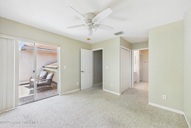 1720 Minutemen Cswy Unit 3, Cocoa Beach, FL 32931 - carpeted bedroom with access to outside, ceiling fan, and connected bathroom