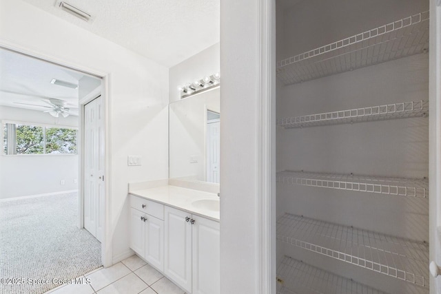 1720 Minutemen Cswy Unit 3, Cocoa Beach, FL 32931 - bathroom with vanity, ceiling fan, and tile patterned flooring