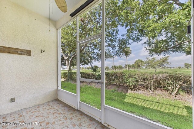1720 Minutemen Cswy Unit 3, Cocoa Beach, FL 32931 - unfurnished sunroom featuring ceiling fan