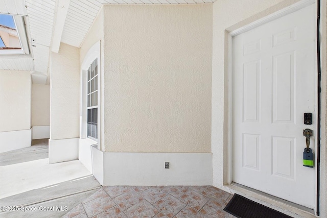 1720 Minutemen Cswy Unit 3, Cocoa Beach, FL 32931 - doorway to property with crawl space and stucco siding