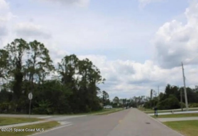 3589 N Chamberlain Blvd, North Port, FL 34286 - view of asphalt road with traffic signs