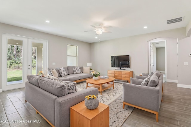 1049 Towhlen St SE, Palm Bay, FL 32909 - living area with a ceiling fan, wood tiled floors, arched walkways, and recessed lighting
