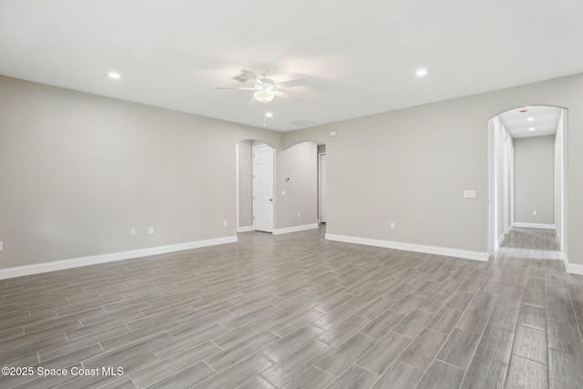 1049 Towhlen St SE, Palm Bay, FL 32909 - unfurnished room featuring arched walkways, a ceiling fan, light wood-type flooring, and recessed lighting