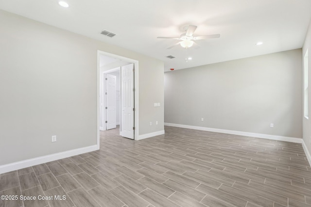1049 Towhlen St SE, Palm Bay, FL 32909 - spare room featuring ceiling fan, light wood finished floors, and recessed lighting
