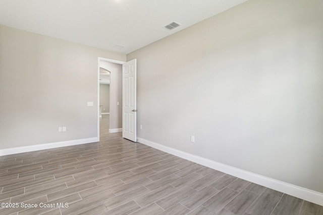 1049 Towhlen St SE, Palm Bay, FL 32909 - empty room featuring baseboards and light wood-style floors