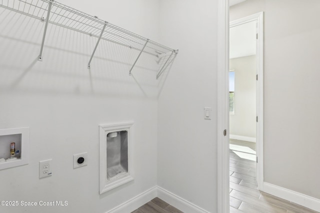 1049 Towhlen St SE, Palm Bay, FL 32909 - laundry room with electric dryer hookup, hookup for a washing machine, and wood tiled floors