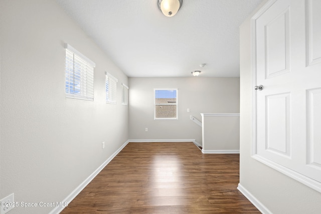 3645 Salt Marsh Cir, West Melbourne, FL 32904 - spare room with dark wood-style floors and baseboards