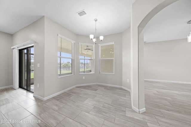 3645 Salt Marsh Cir, West Melbourne, FL 32904 - unfurnished dining area with a chandelier and arched walkways