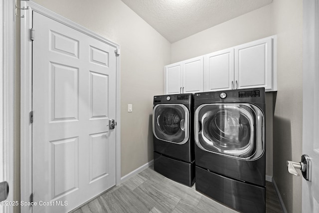 3645 Salt Marsh Cir, West Melbourne, FL 32904 - laundry area with cabinet space, independent washer and dryer, and a textured ceiling
