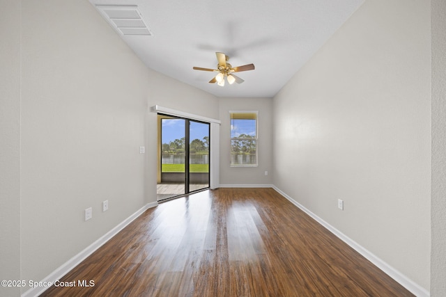 3645 Salt Marsh Cir, West Melbourne, FL 32904 - spare room featuring ceiling fan and dark wood-style flooring