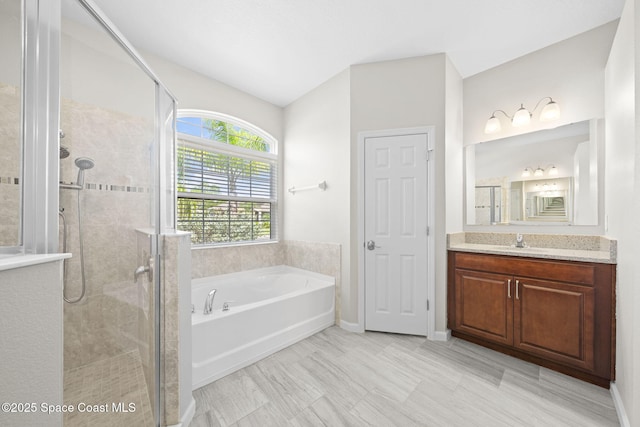 3645 Salt Marsh Cir, West Melbourne, FL 32904 - full bathroom featuring a garden tub, a shower stall, vanity, and lofted ceiling