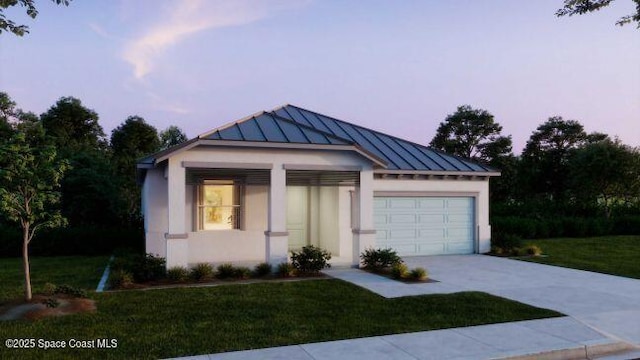 777 Clearwater Ave, Satellite Beach, FL 32937 - view of front facade with stucco siding, a standing seam roof, concrete driveway, and an attached garage